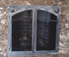 square to arch, black frame with antique copper twin doors 